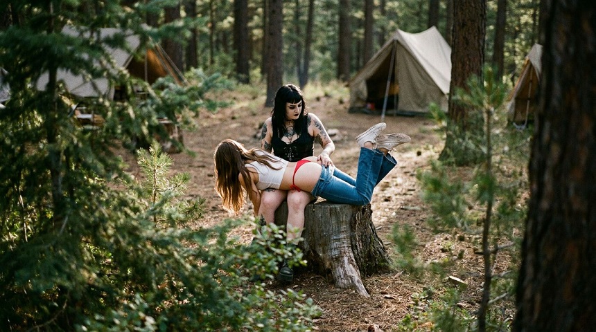 Goth Woman Spanks Naughty Teen at the Campside